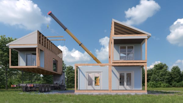 A crane works to stack modular sections together