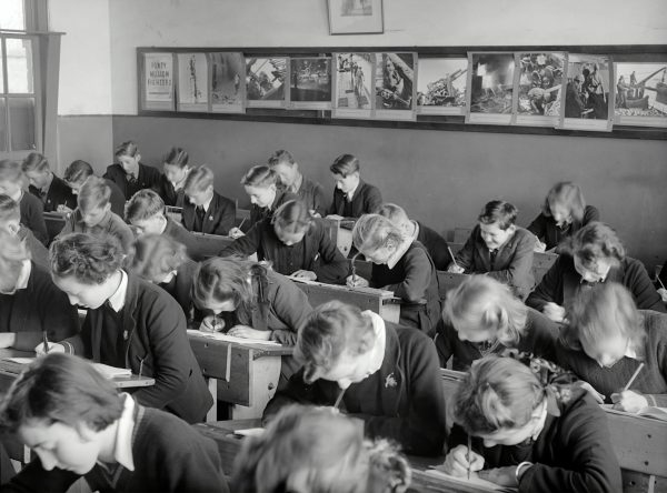 Children crowd into a small classroom